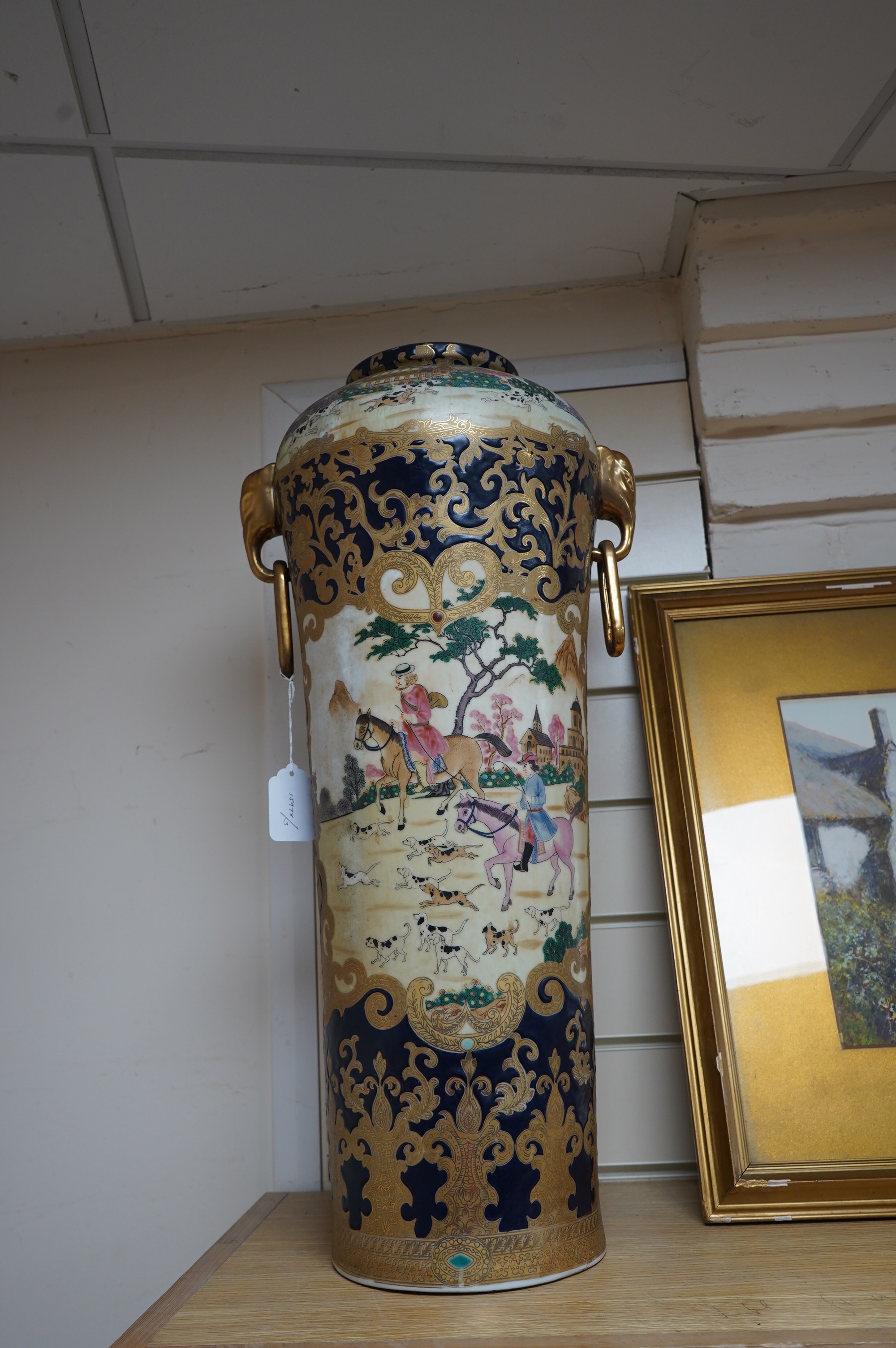 A 20th century Chinese vase decorated with figures on horseback, 63cm high. Condition - good